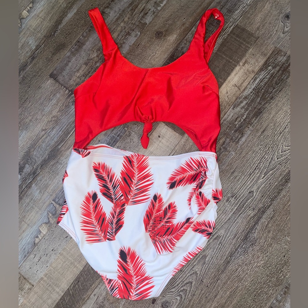 One piece cut out maternity bathing suit with tropical pattern.
